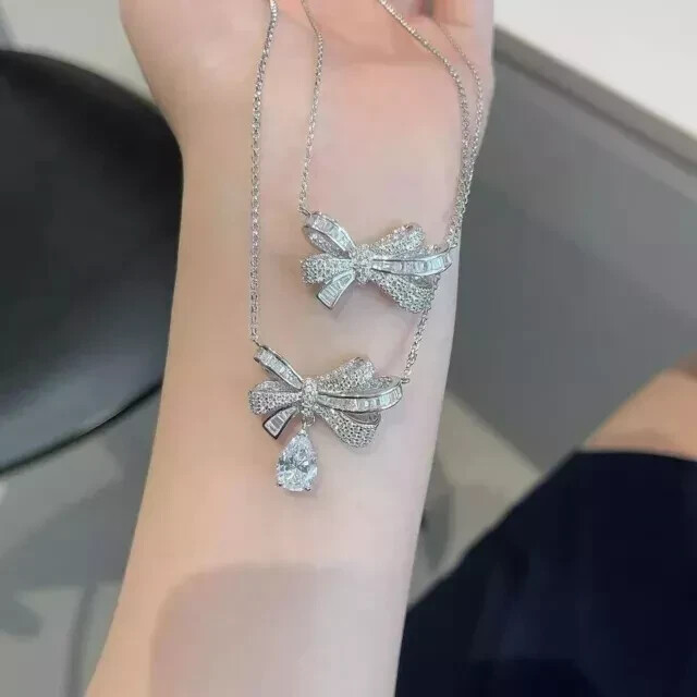 1.50Ct Pear Cut Moissanite Bow Butterfly Pendant 14K White Gold Plated 18″ Chain