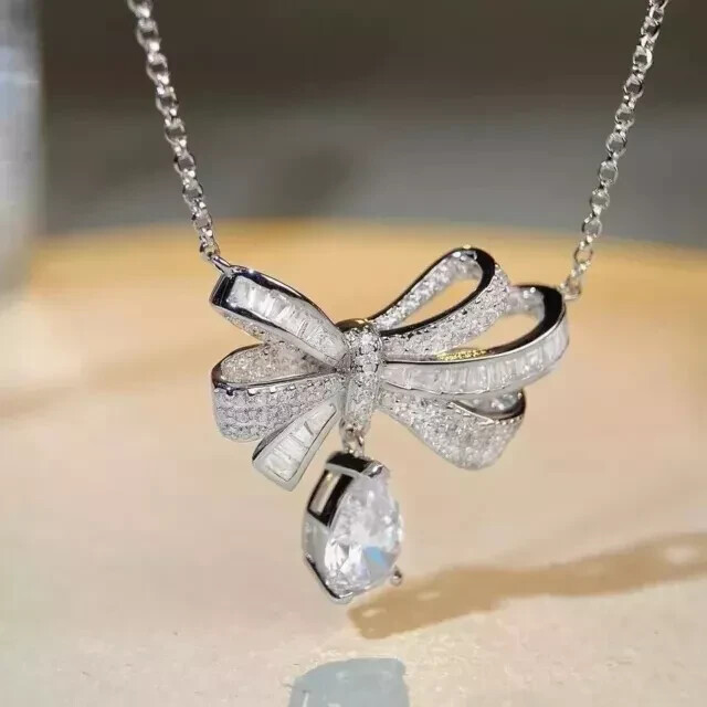 1.50Ct Pear Cut Moissanite Bow Butterfly Pendant 14K White Gold Plated 18″ Chain